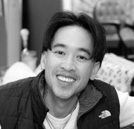 Kevin Nguyen headshot holding scissors in the foreground