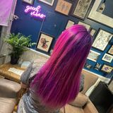 Back of woman showing stunning fuschia and purple dye job